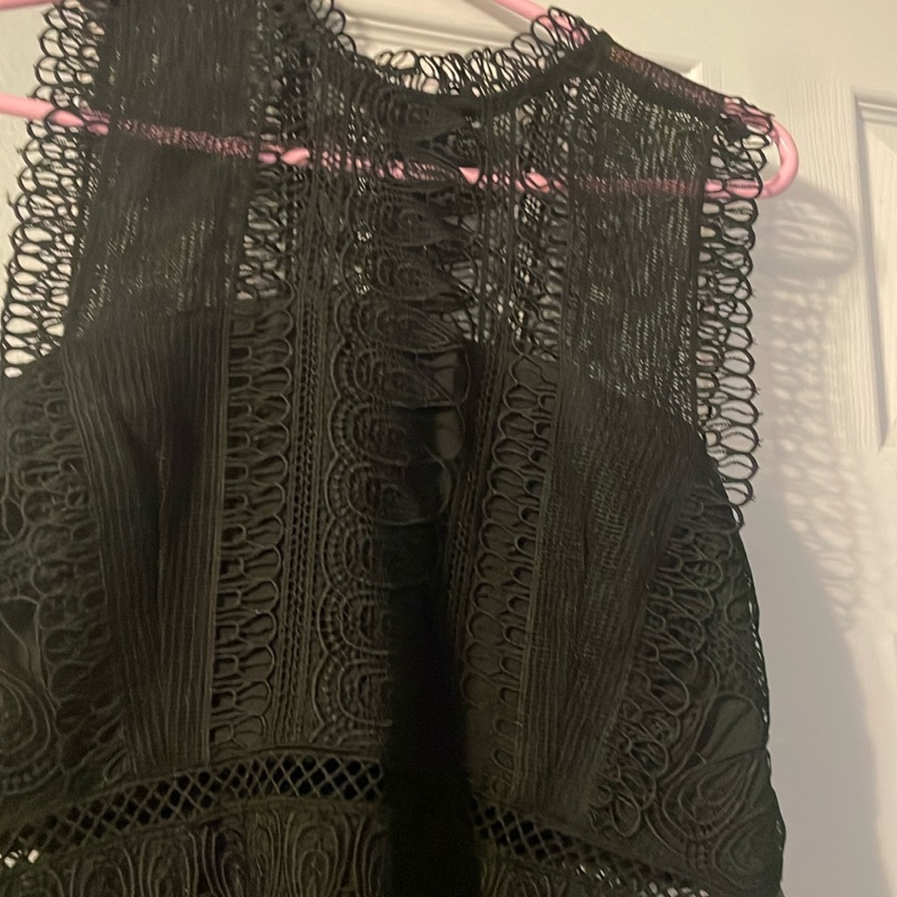 Woman’s size large formal dress. Black brand new with tags never worn .